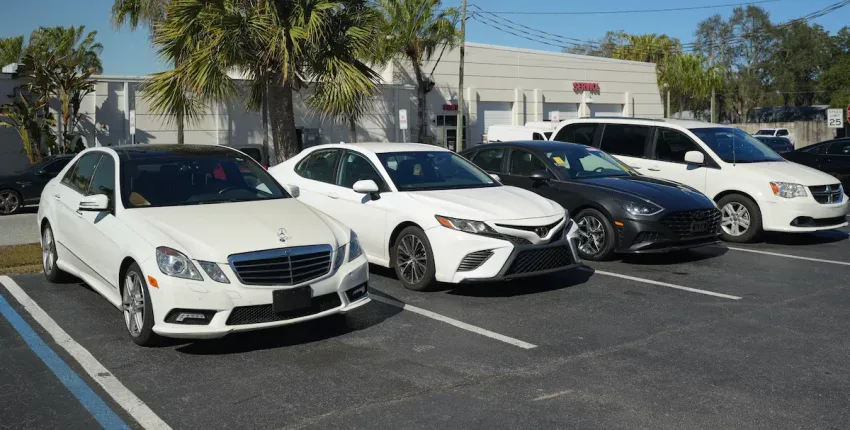 Line of luxury and family cars parked at Orlando Auto Repair.