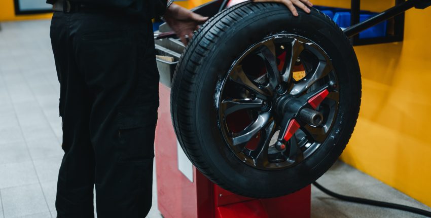Technician rotating a car tire at Parney’s Car Care in Hillsdale.