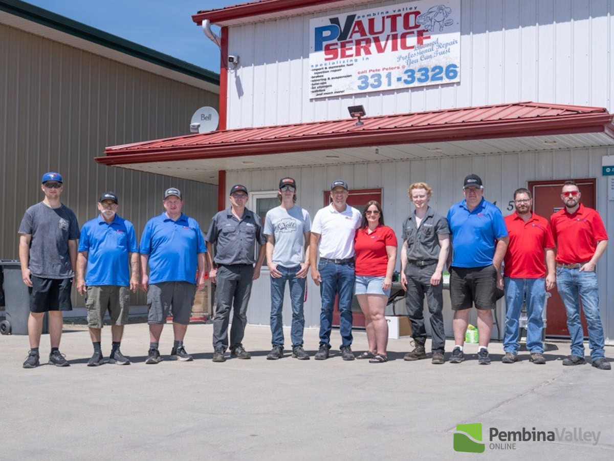 Auto Service team standing outside Pembina Valley Auto in Manitoba.