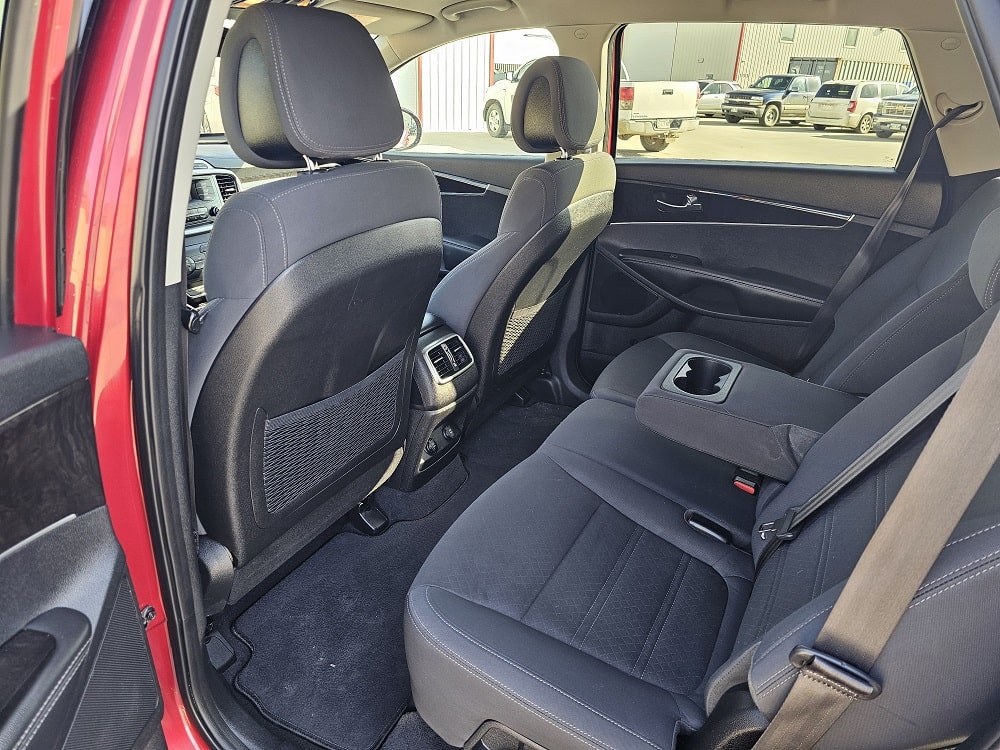 Interior view of a modern vehicle's back seats, showcasing spaciousness and comfort.