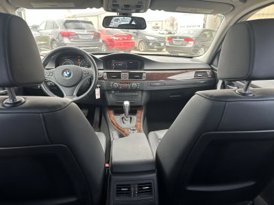 BMW interior dashboard and front seats in a modern vehicle.