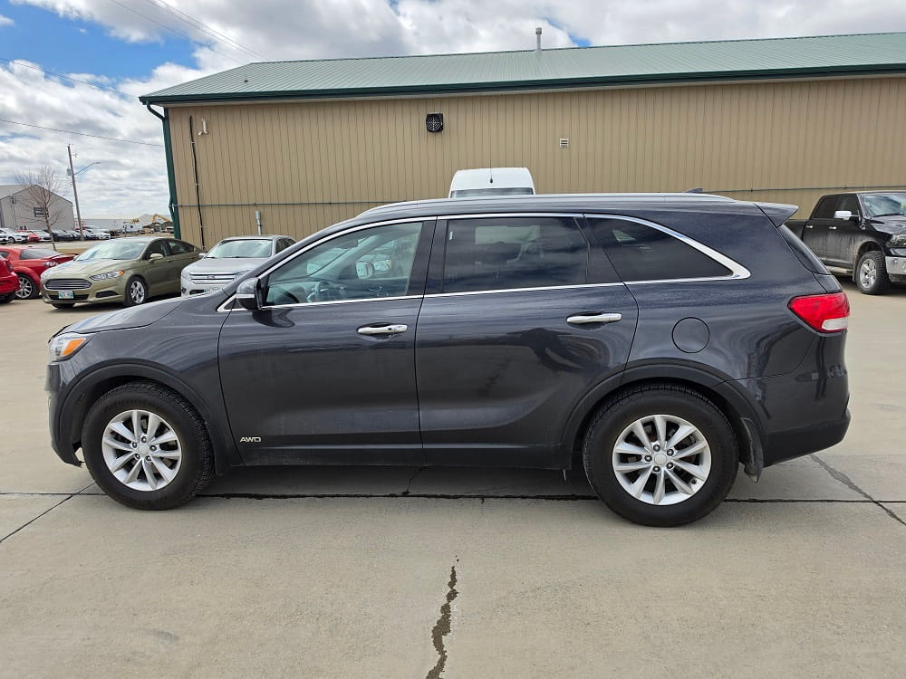 SUV parked outside Pembina Valley Auto dealership.