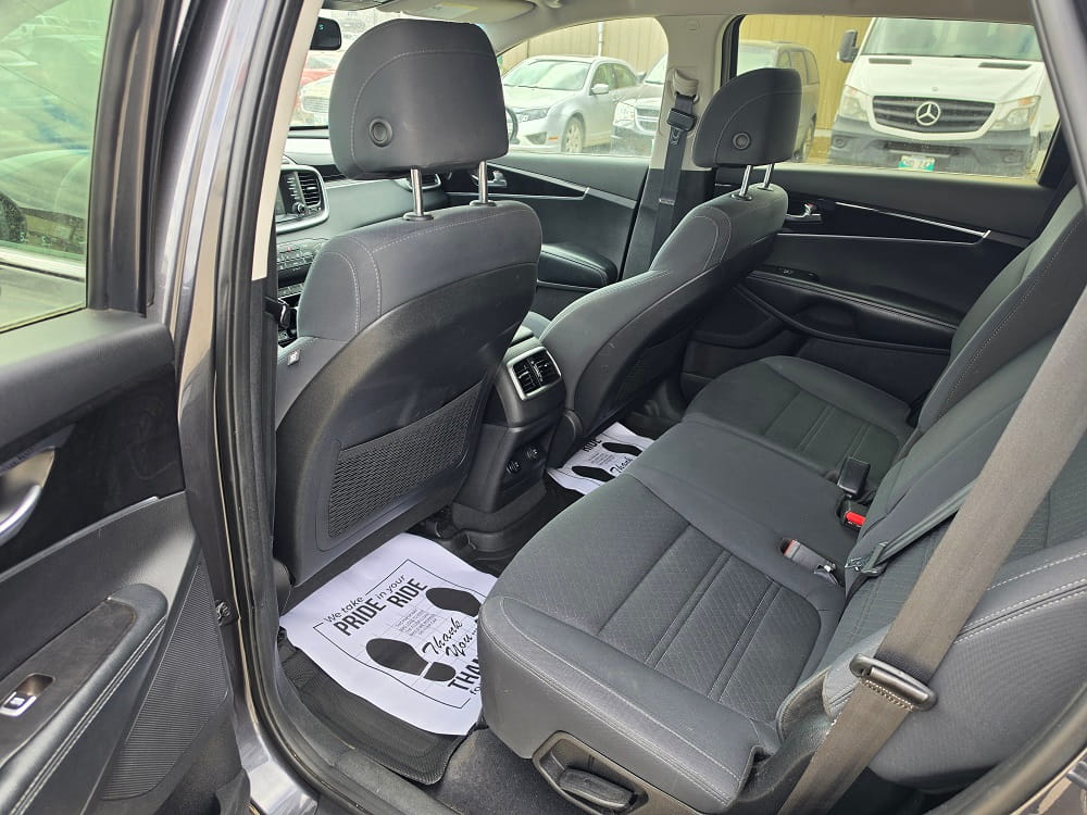 Interior view of a modern car showing the back seats and dashboard.