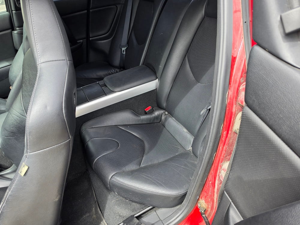 Car interior seats with black upholstery in a vehicle.