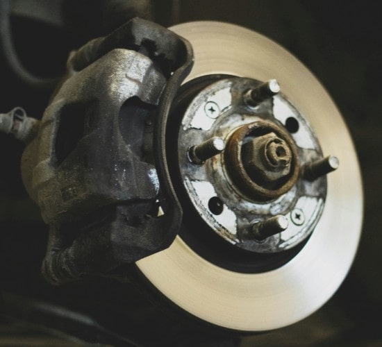 Car brake disc and caliper repair service at Penguin Auto.