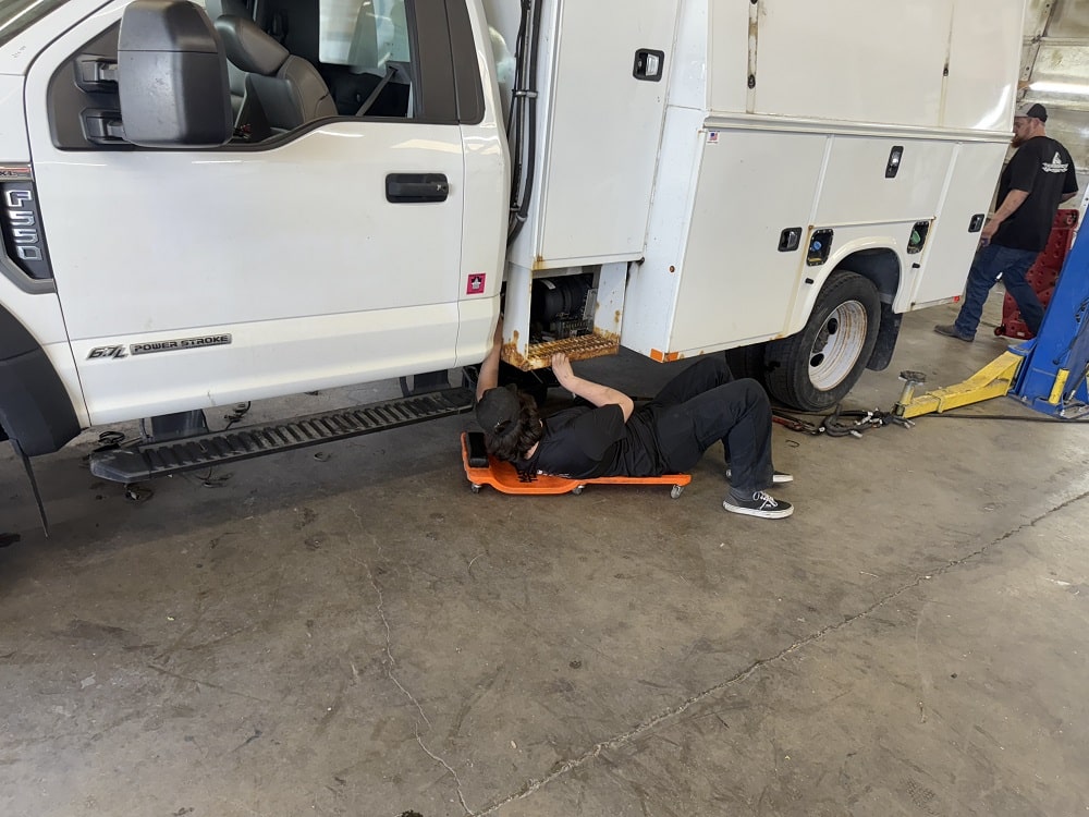 Technician inspecting a service vehicle at Performance Authority in Bend, OR.