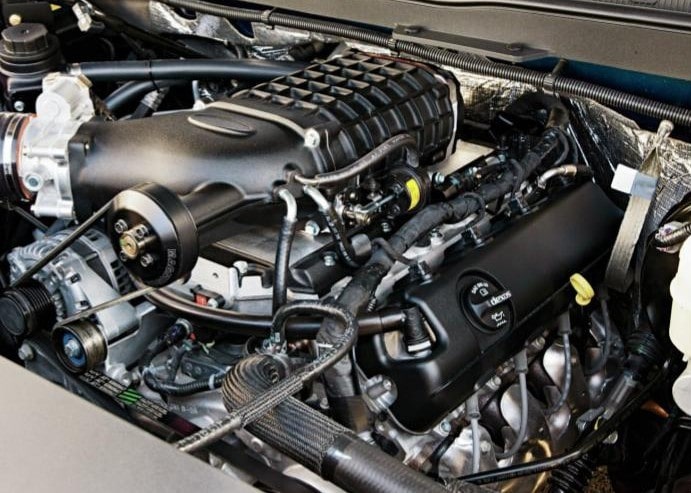 Engine bay with high-performance components and modifications.