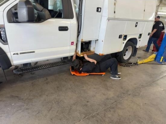 Technician inspecting a service vehicle at Performance Authority in Bend, OR.