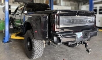 Heavy-duty truck lifted for maintenance at Performance Authority in Bend.