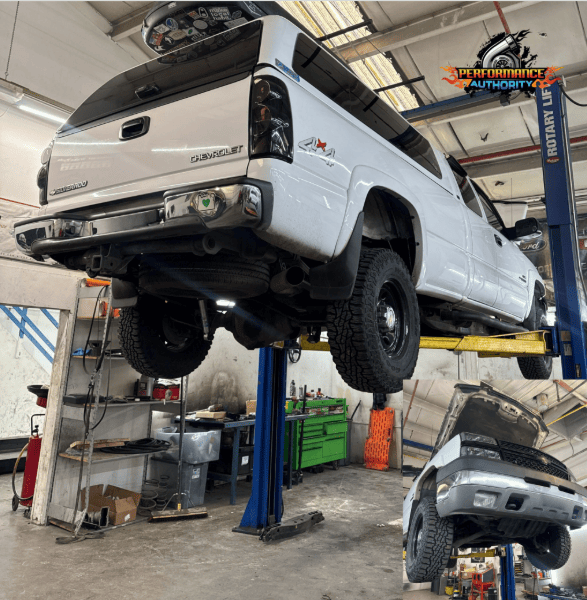 Lifted white pickup truck at Performance Authority for vehicle performance upgrades.