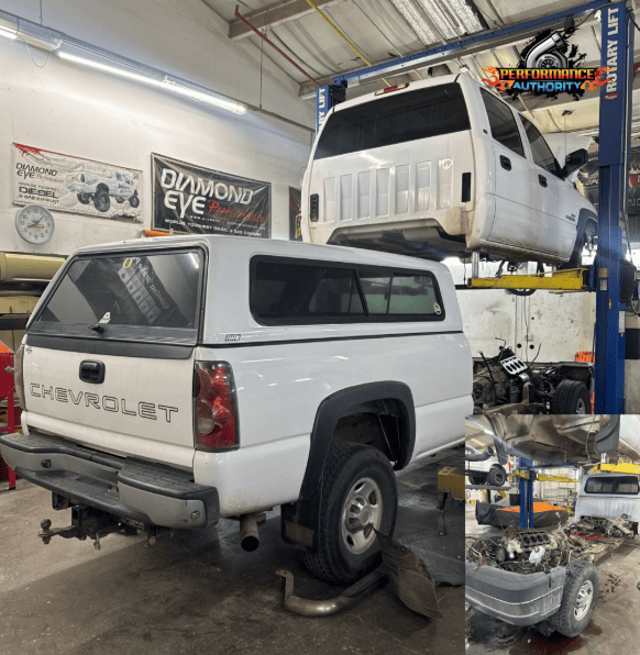 Auto repair shop with lifted trucks and vehicle parts in Bend, OR.