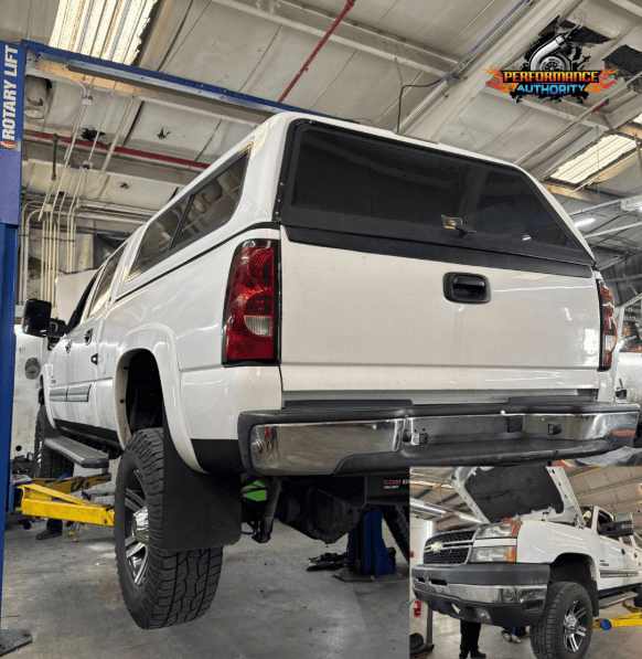 White SUV lifted on automotive lift at Performance Authority in Bend, OR.