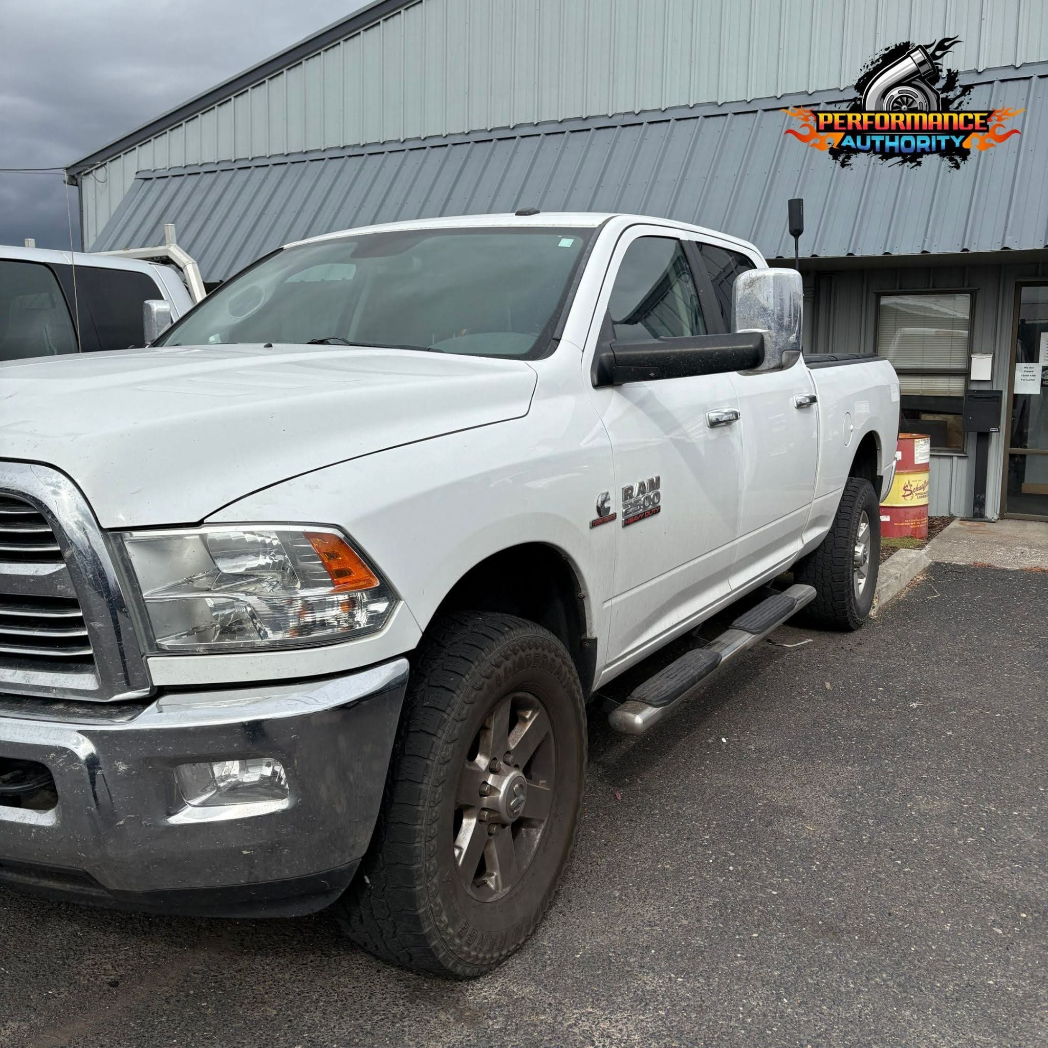 White RAM truck parked outside Performance Authority in Bend, Oregon.