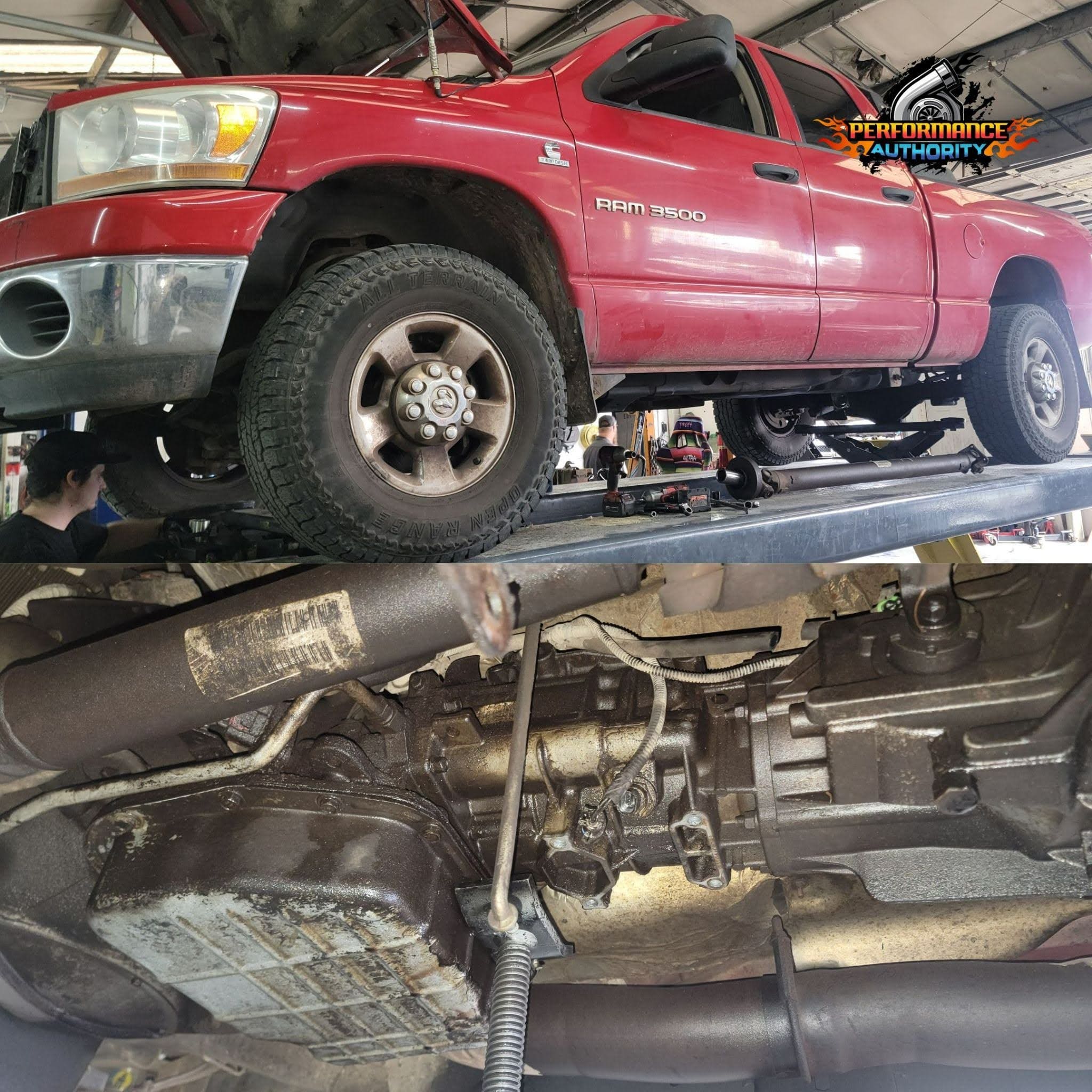 An image of a red Ram 1500 truck elevated on a lift at Performance Authority, showcasing vehicle mai.