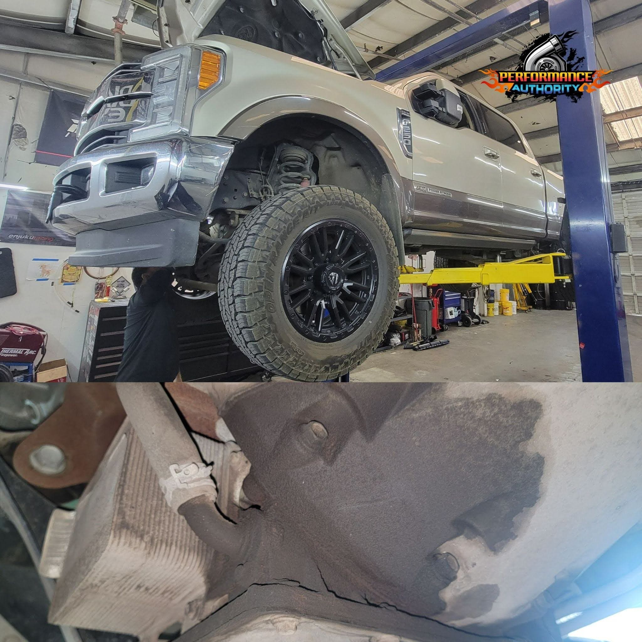 Vehicle lifted on a hydraulic lift at Performance Authority for repair or inspection. Expert automot.