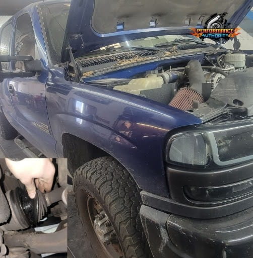 Blue pickup truck undergoing engine repair at Performance Authority.