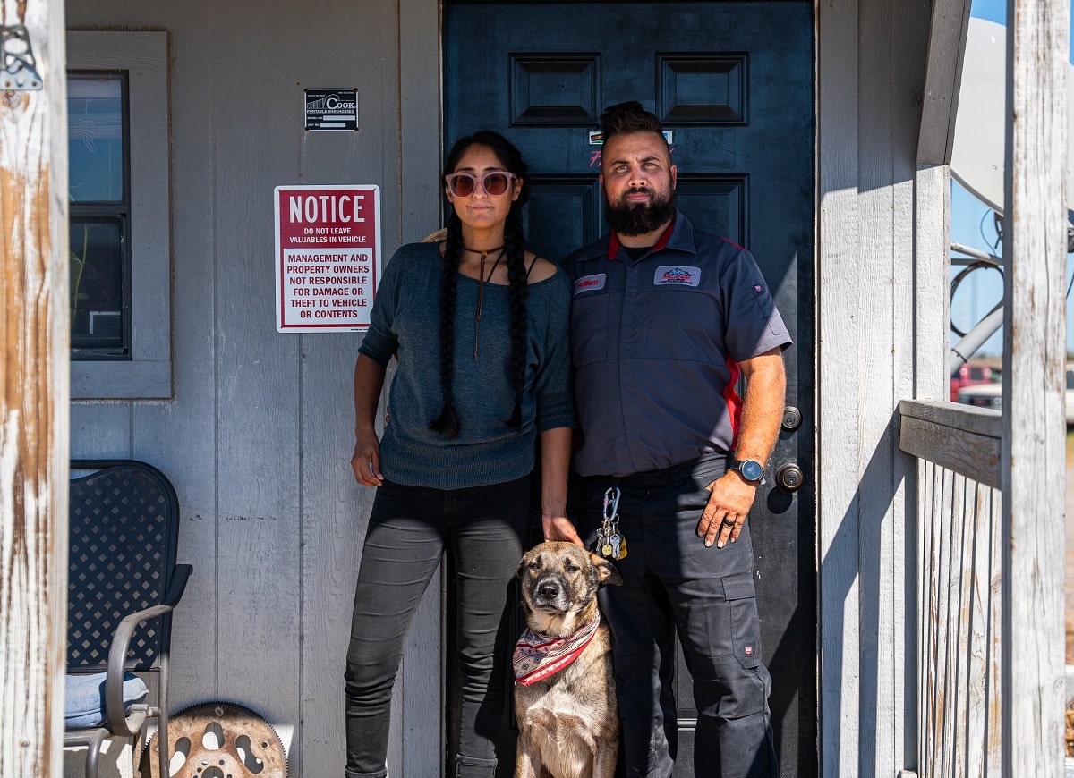 Auto repair technician and customer with service dog at Phantom Auto Repair.