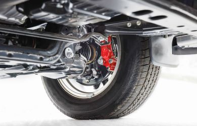 Vehicle suspension and wheel assembly at Phantom Auto Repair shop.