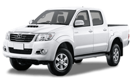 White pickup truck at Phantom Auto Repair shop, showcasing vehicle maintenance and repair services.