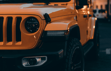 Yellow Jeep vehicle close-up, showcasing automotive repair services.