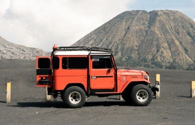 Off-road vehicle being serviced at Phantom Auto Repair shop in a rugged outdoor setting.