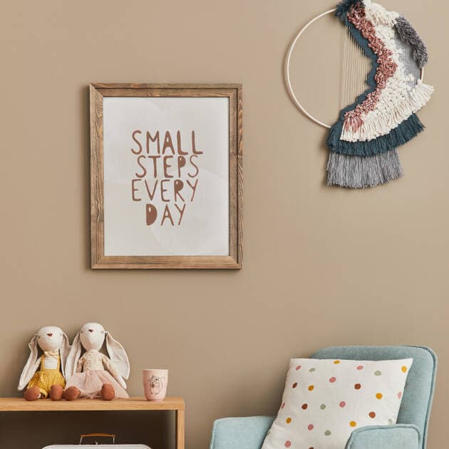 Bright interior wall decor with framed quote and textile wall art at Phoenix Painting service images.