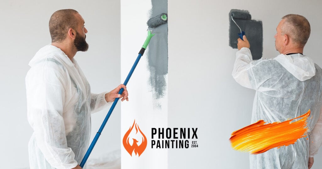 Two painters working on a wall.