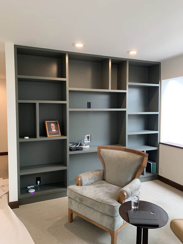 Empty bookshelf with a chair.