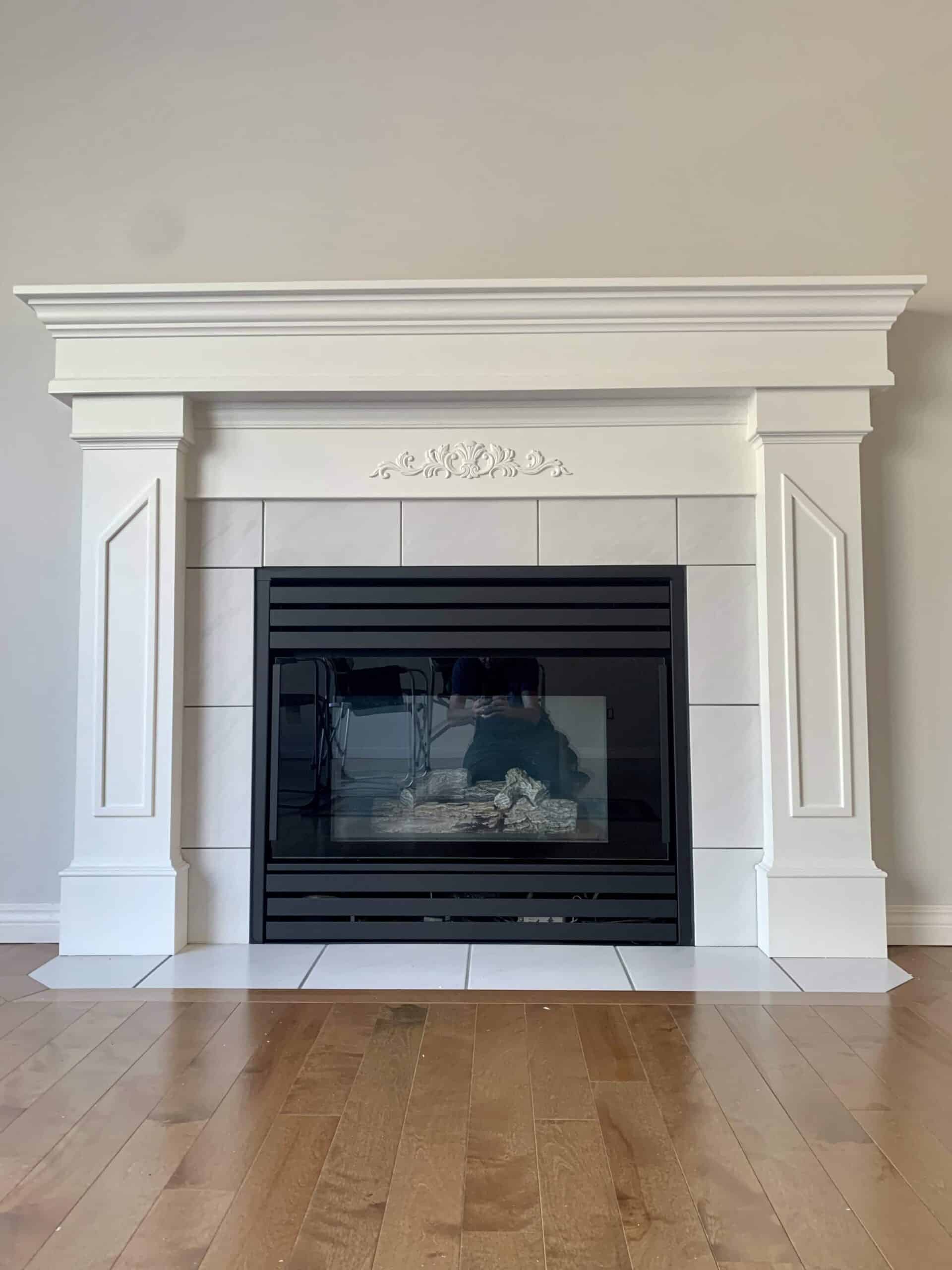 Wooden fireplace with green tiles