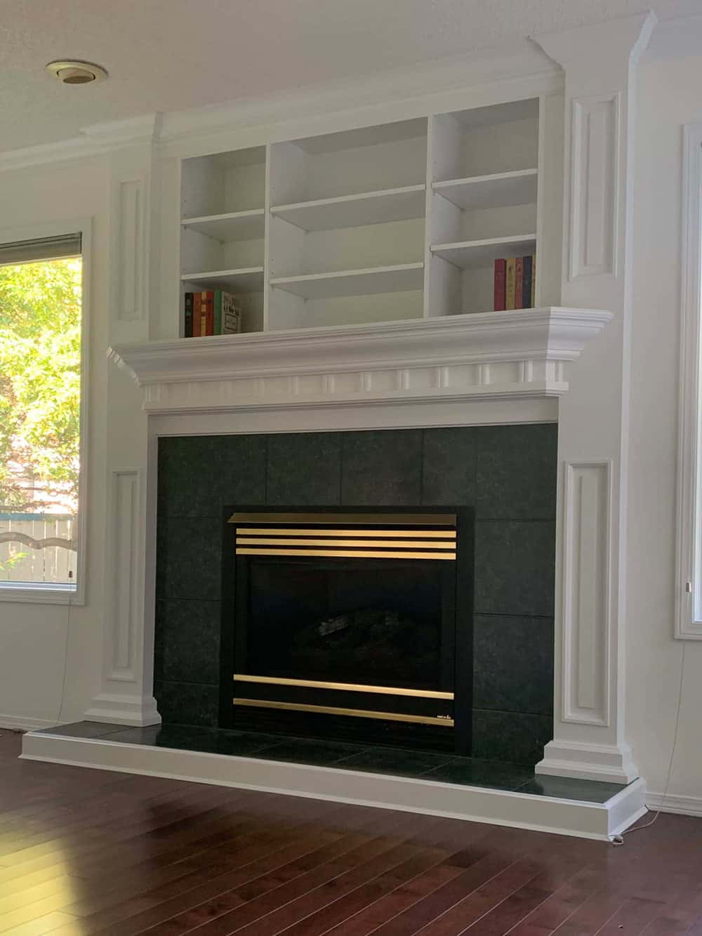 Modern fireplace with built-in shelves