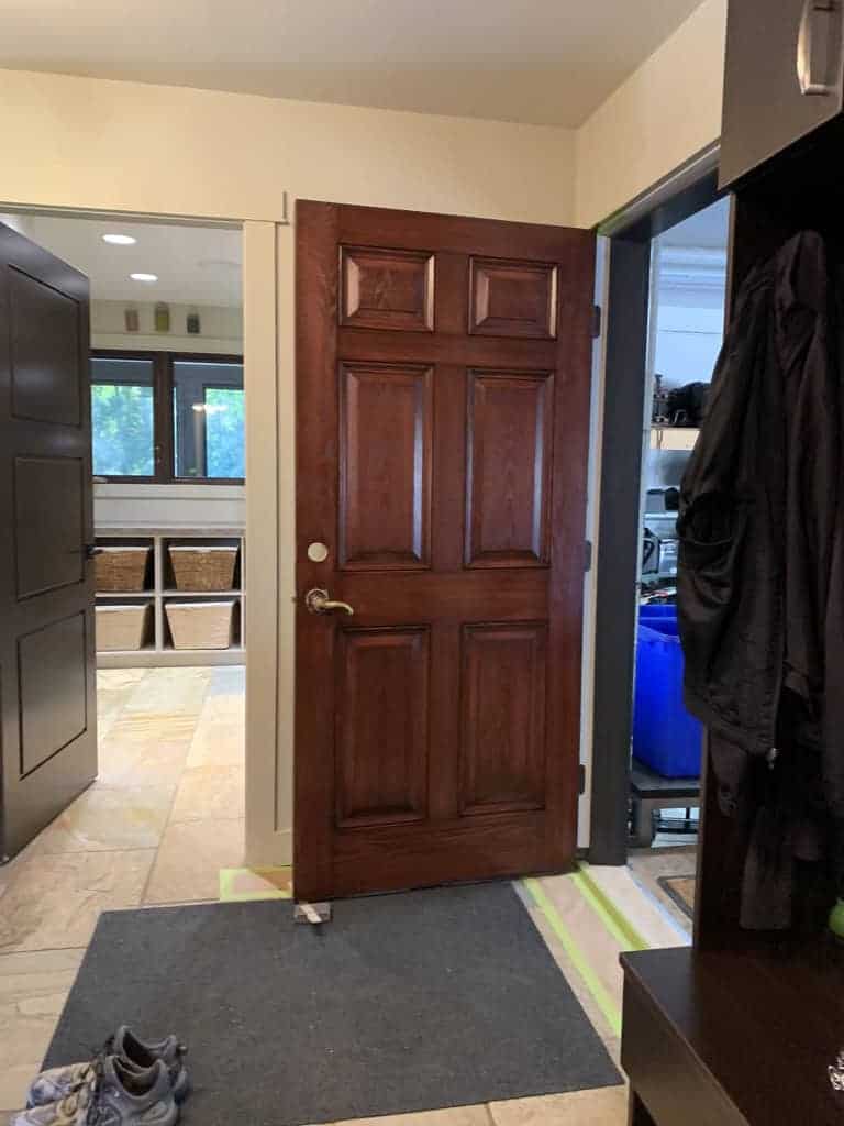 Open wooden door in hallway