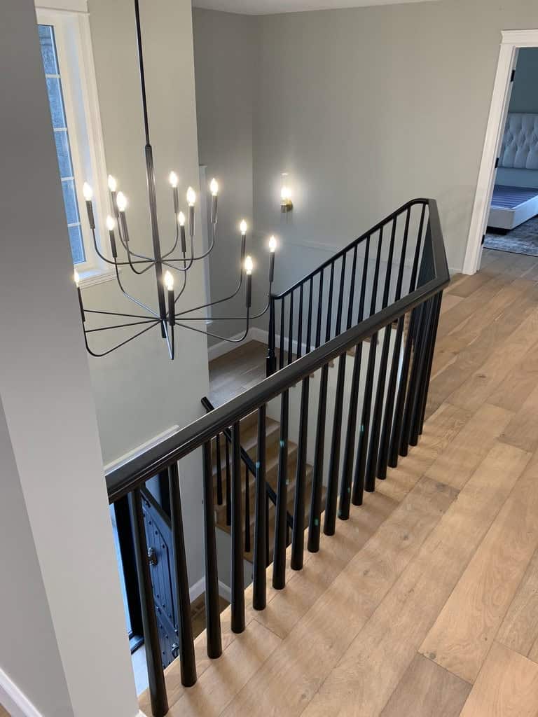 Modern staircase with stylish chandelier.