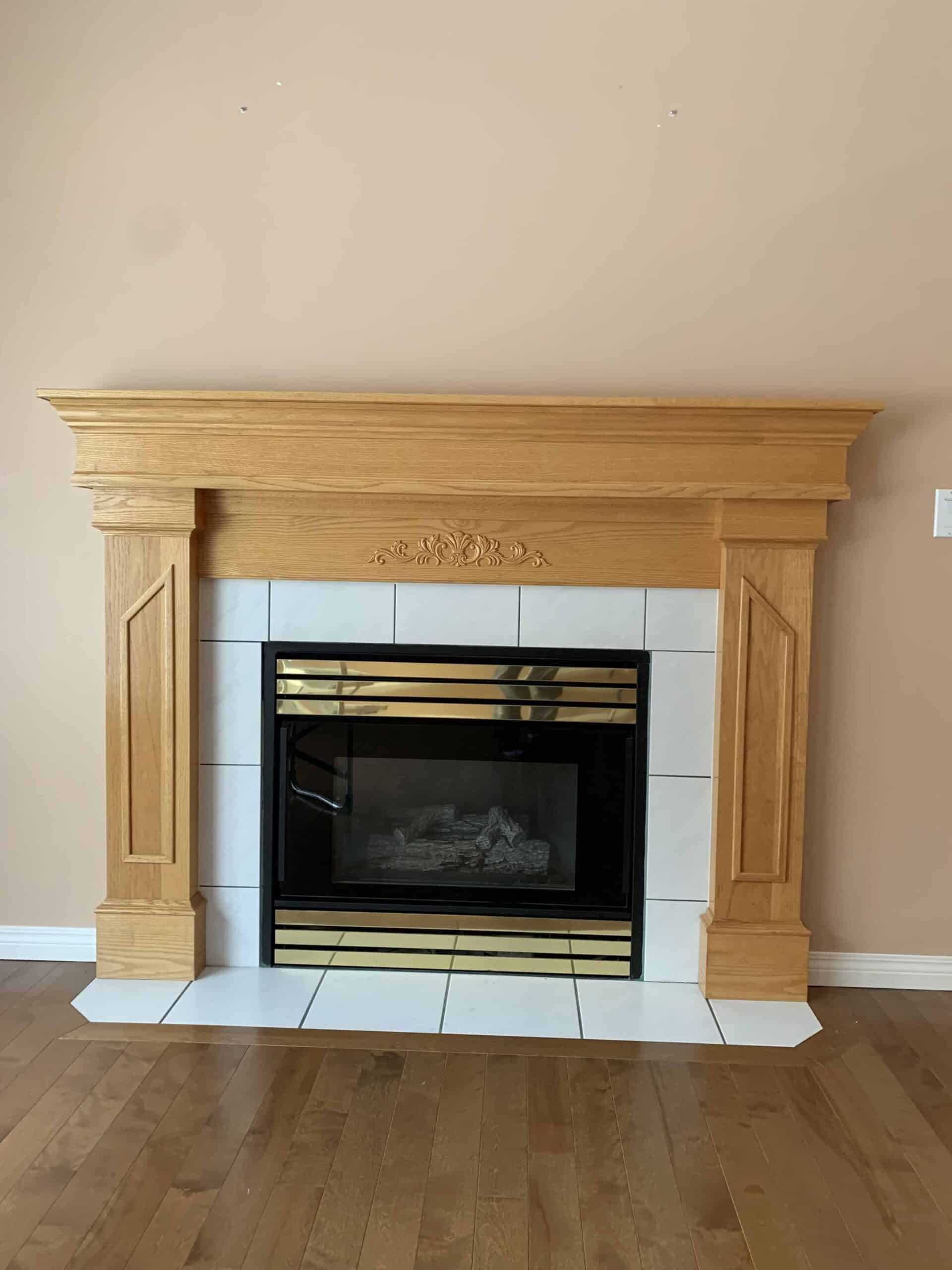 Elegant wooden fireplace with tiles