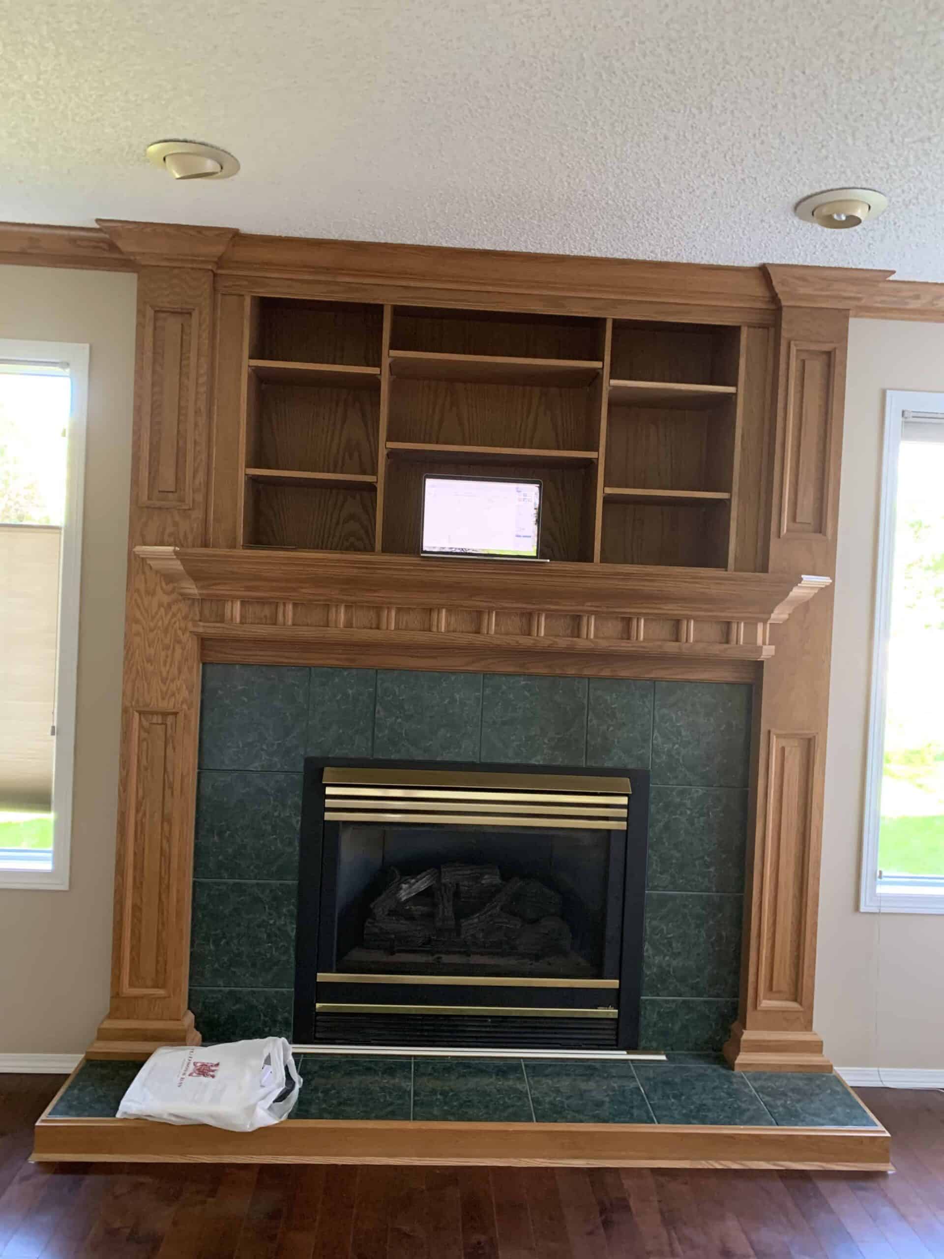 Wooden fireplace with green tiles