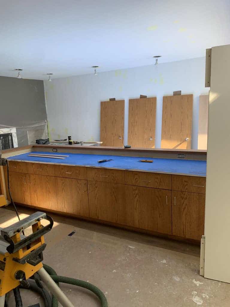 Empty room with wooden cabinets and counters