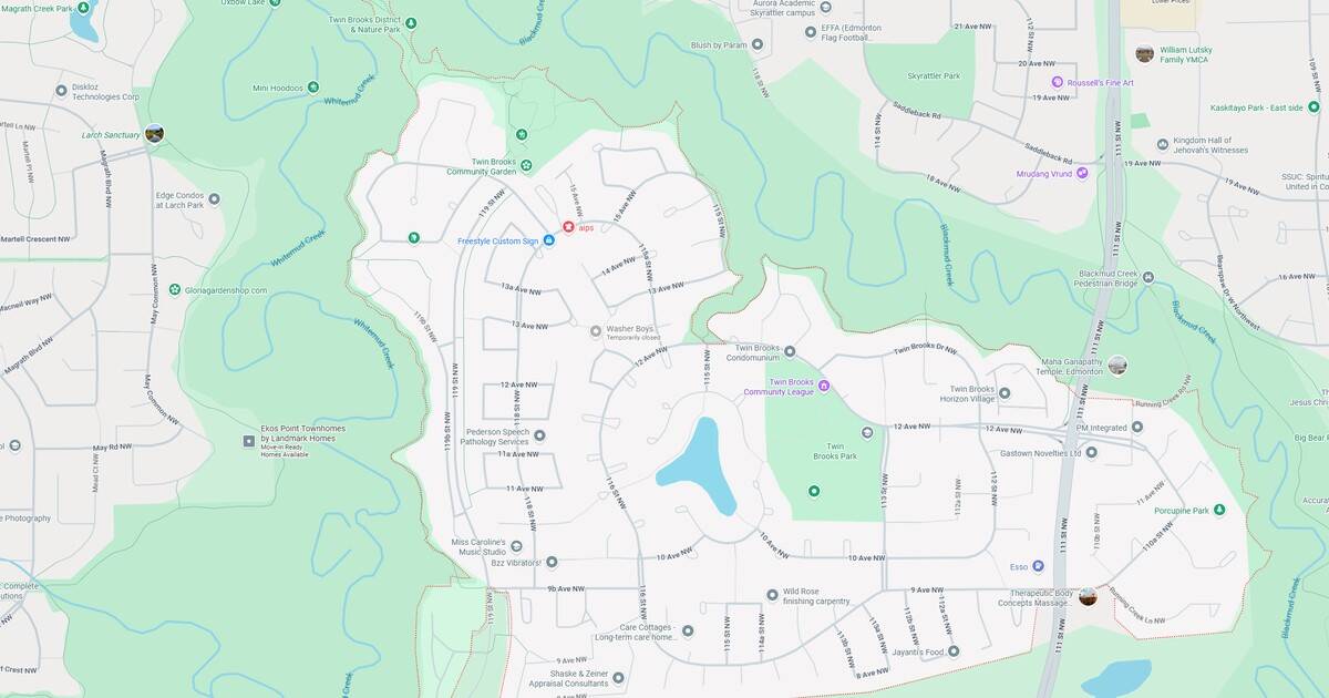 Sprawling community park with walking trails, pond, and green spaces in Twin Brooks, Edmonton. Ideal for outdoor activities, family outings, and nature walks.