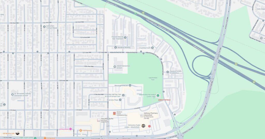 Detailed map showing streets, parks, and highways in a suburban area, highlighting transportation routes and green zones for urban planning and navigation.