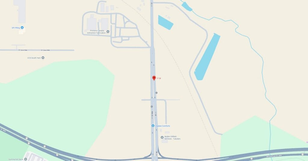 Map showing a farm road running parallel to a water body in a rural setting, with surrounding fields and minimal infrastructure.