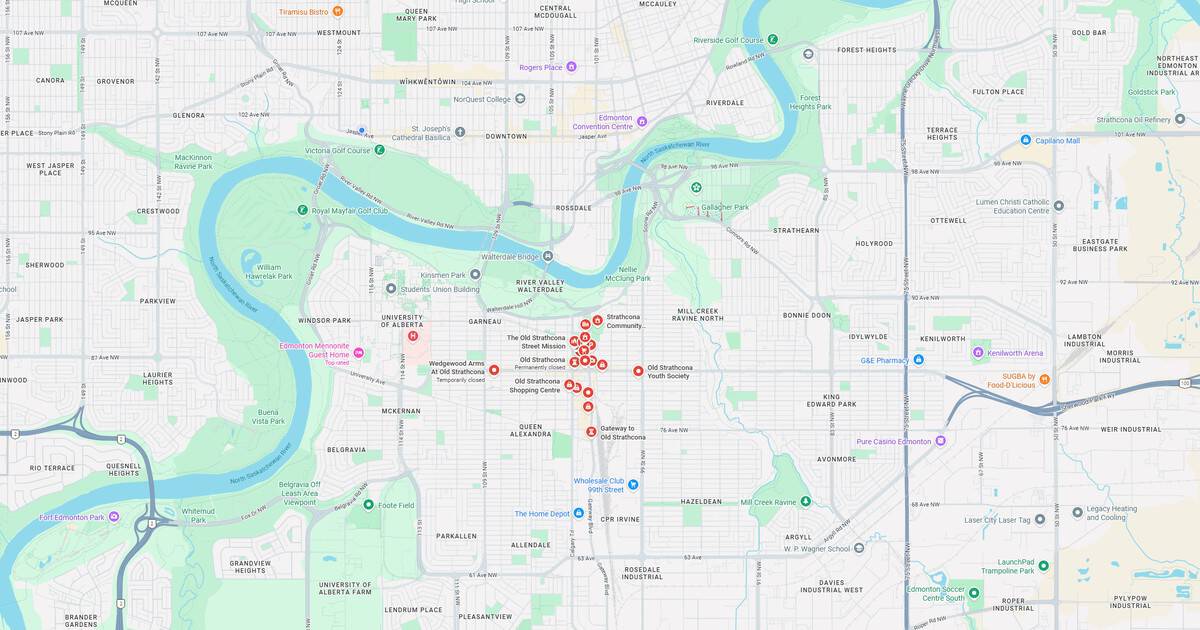 Map of riverfront park, city streets, and nearby landmarks in an urban setting.