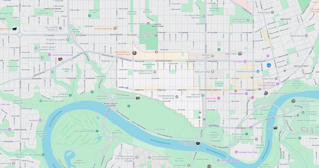Detailed city map showing streets, parks, and a river with various points of interest and transit routes.