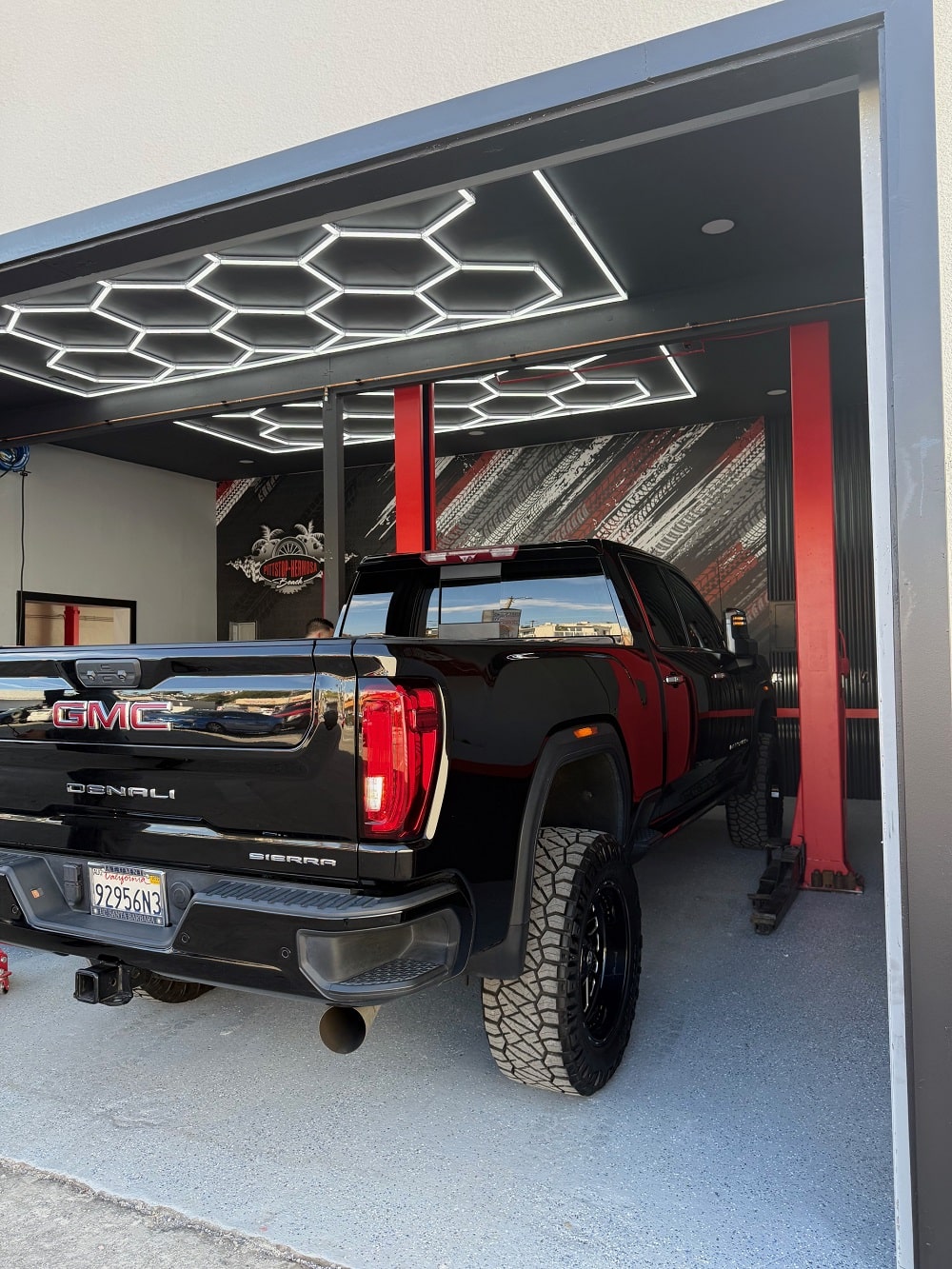 GMC Sierra truck parked inside Pittstop Auto Care for maintenance or repair services.