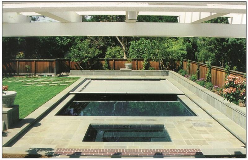 Small pool covered with a blue tarpaulin during the winter season to cover it and prevent dirt.