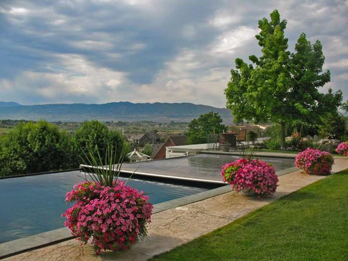 Small pool covered with a blue tarpaulin during the winter season to cover it and prevent dirt.