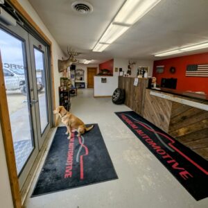Interior of Premium Auto Repair Inc with reception desk and waiting area.