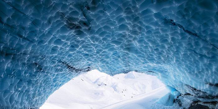 An image that shows Heliskiing Ice Cave Skier Travis Ganong Photo Credit Â©keokiflagg2022 Copy