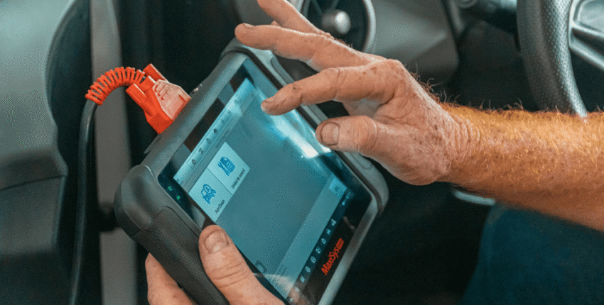 Engine diagnostic scan at Qwik Oil & Auto Care for vehicle health.