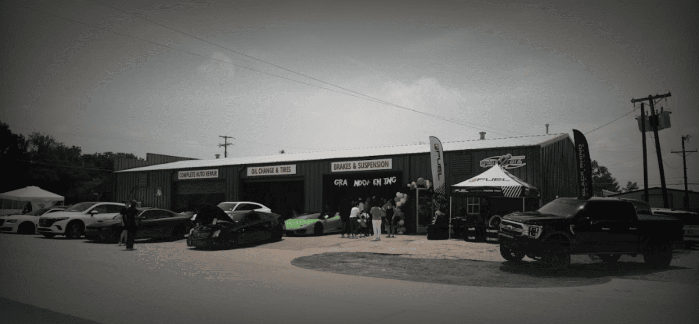 Qwik Oil & Auto Care auto repair shop with cars parked outside, offering oil changes and vehicle mai.