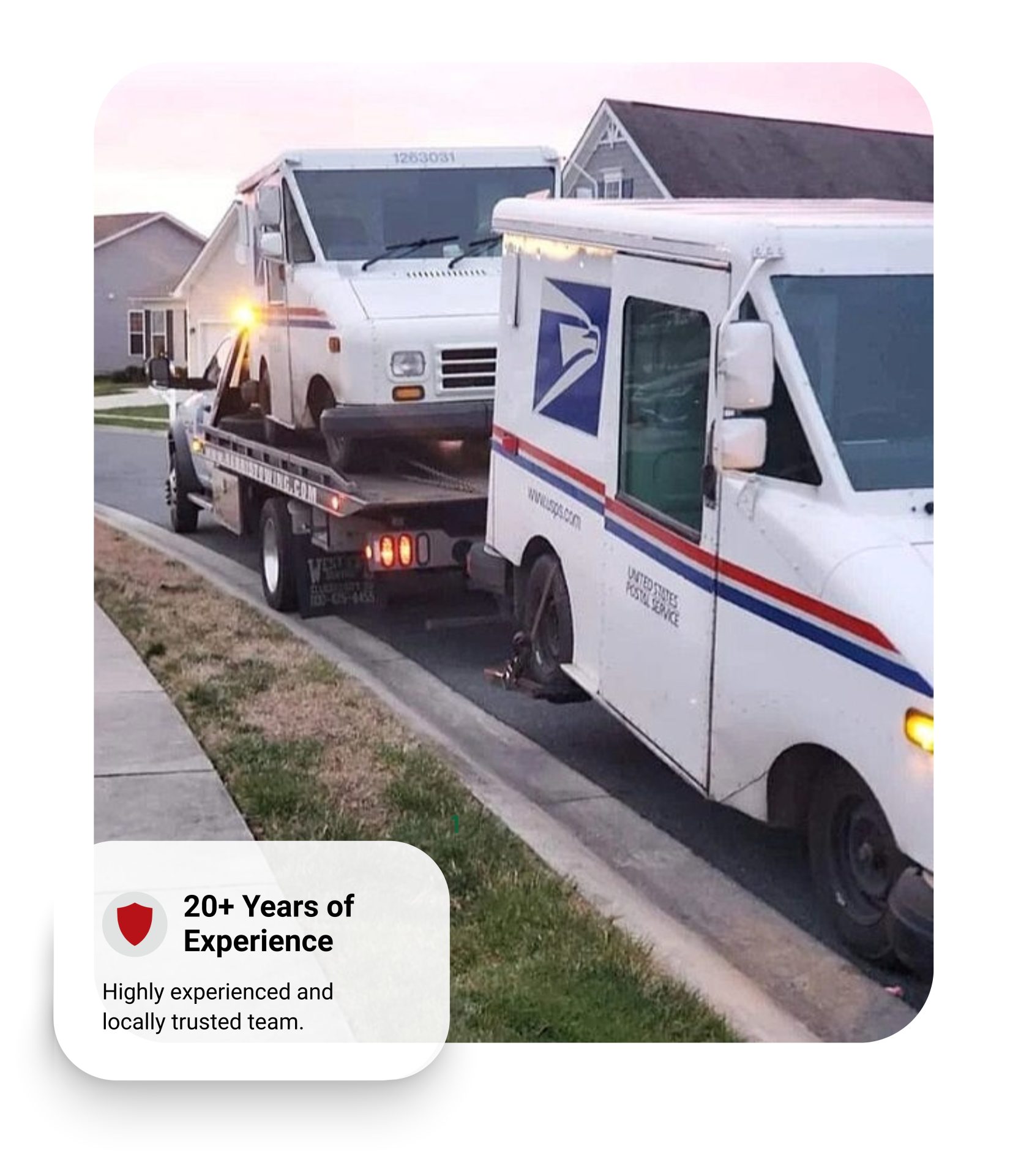 Professional towing service with a flatbed truck transporting a vehicle.