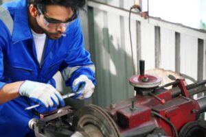 auto-mechanics-making-wheel-alignment-car-service