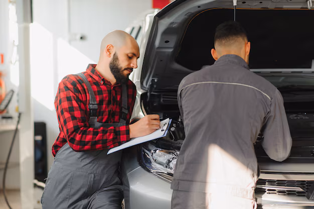 mechanic-men-with-wrench-repairing-car-engine-workshop